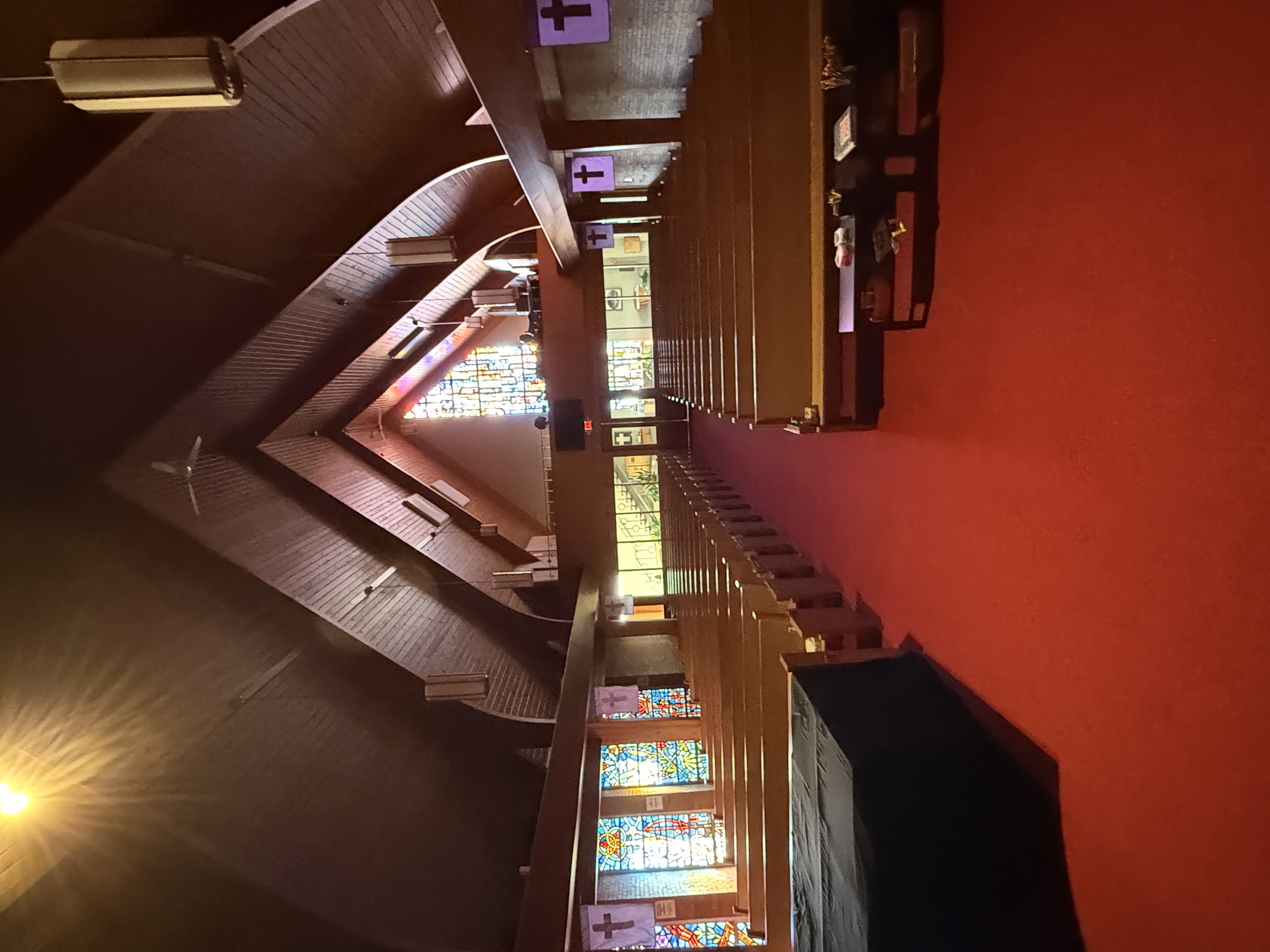 Sanctuary interior with stained glass windows